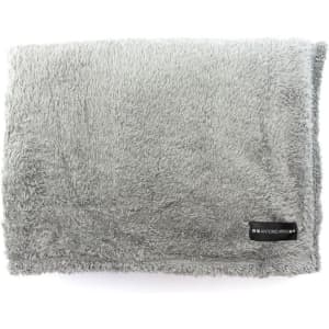 A soft, fluffy grey blanket with a label, ideal for home living.