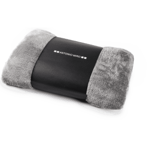 A grey and black blanket featuring a plush texture and a logo in the centre.