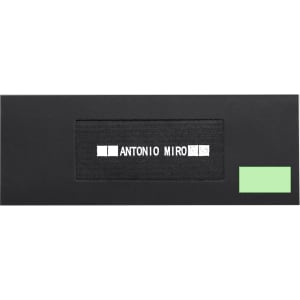A sleek black packaging featuring a prominent logo and a small green accent. Ideal for gifting or storing items.