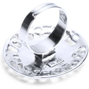 A silver adjustable ring with a decorative circular design and an inner band. It features a logo on the base.