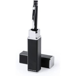 A black metal pen stands upright in a sleek rectangular holder, with two matching black bases beside it.