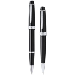A set of two metal pens in black and silver, featuring a sleek design and a branding logo.