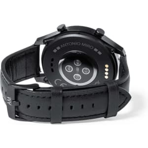 A black smart watch featuring a leather strap and a circular back with sensors, also displaying a branding logo.