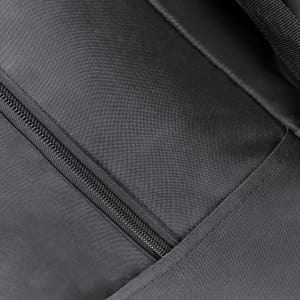 A close-up of the interior of a black trolley backpack featuring a zippered compartment and textured fabric.