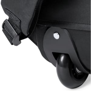 A black trolley backpack with a wheeled base, featuring a sturdy wheel and adjustable strap.