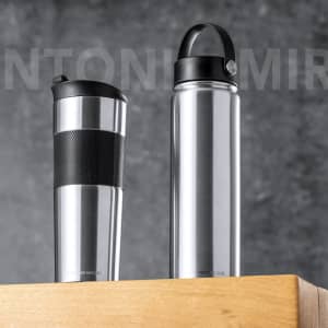 A drink bottle set featuring a silver insulated travel mug and a sleek silver insulated cup, both with black accents.