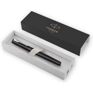 A black metal pen inside a white and black presentation box, featuring a logo.
