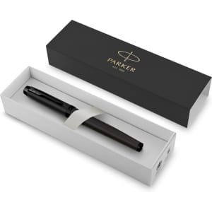 A metal fountain pen in a sleek black box with a white insert. The pen is dark with a branding logo.
