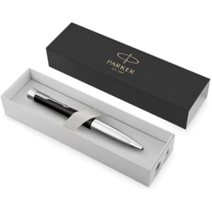 A sleek black metal pen with a silver clip, placed inside a white box with a black exterior and a branding logo.