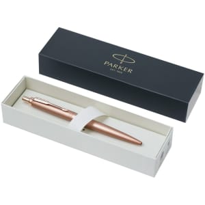 A metal pen in a rose gold finish, presented in a two-tone box with a logo.