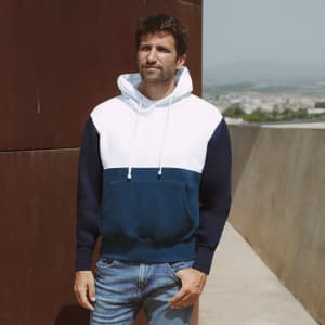 A navy and white adult sweatshirt with a hood, featuring a front pocket and a branding logo.