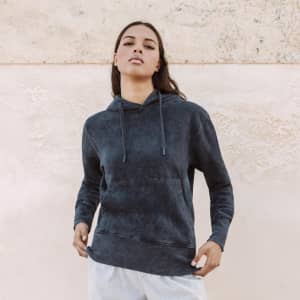 A dark blue adult sweatshirt with a hood and front pocket, featuring a logo on the chest.