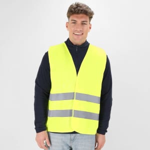 A reflective safety vest in bright yellow with silver stripes, worn by a smiling male model.