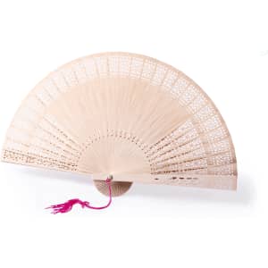 A wooden hand fan in a light tone with intricate cut-out designs and a pink tassel. Features a logo on the base.