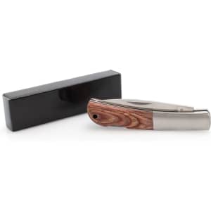 A wooden handle pocket knife with a stainless steel blade, placed beside a black box.