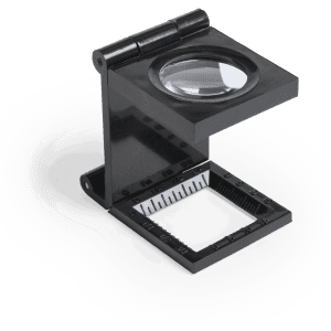 A black folding magnifying glass with a built-in ruler and a large lens for close-up viewing.