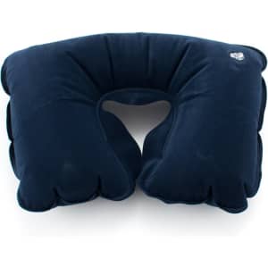 A navy blue travel pillow with a cut-out design for neck support, featuring a small logo.