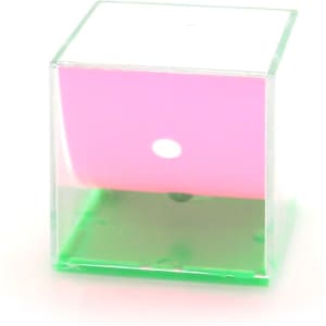 A translucent cube game in pink and green, featuring a small white dot inside. The cube has a glossy finish and a logo.