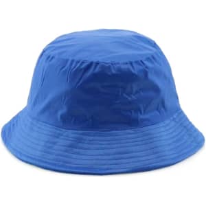 A blue reversible bucket hat with a wide brim and a logo on the side. Ideal for headwear.