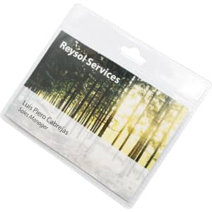 A clear plastic badge holder with a scenic forest background, featuring space for a name and title.