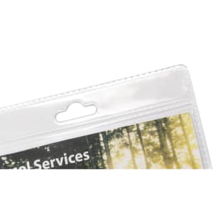 A clear plastic name badge holder with a top hang hole, showcasing an image featuring trees in the background.