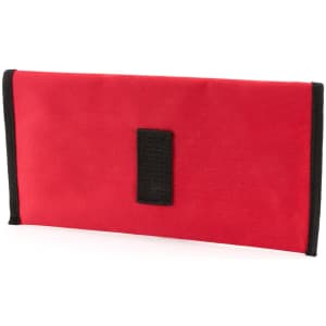 A red travel document holder with a black trim and an attached logo.