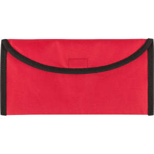 A red travel document holder with a black trim and a logo, designed to keep documents organised.