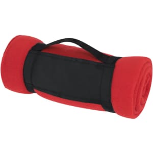 A rolled red fleece blanket with a black strap for carrying and a branded patch on the side.