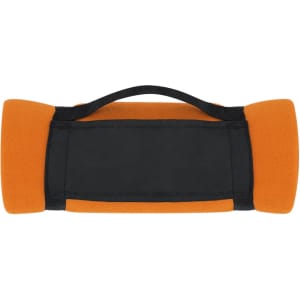 An orange mountain blanket with black accents and a carrying handle.