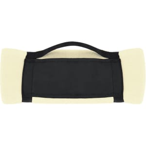 A soft fleece mountain blanket with a black base and cream-coloured ends, featuring a carrying handle.