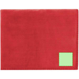 A red Mountain Blanket with a green stitched label in the corner. Soft and warm fabric ideal for home use.
