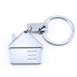 A silver keyring shaped like a house, featuring a small chimney and a window design.