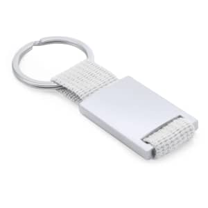 A keyring featuring a silver metallic tag and a white fabric strap with a circular metal ring attachment.