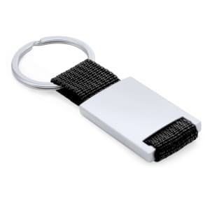 A silver keyring with a rectangular metal piece and a black woven strap. Features a logo on the metal.