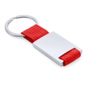 A red fabric keyring with a metal attachment and a silver rectangular metal piece.