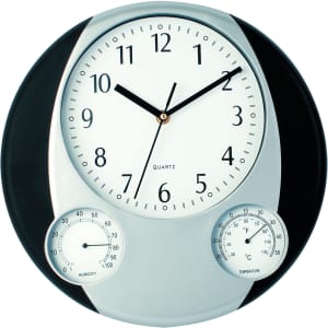 A wall clock featuring a white face with black numbers, silver accents, and dials for humidity and temperature.