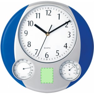 A round wall clock featuring a white face with black numbers, blue and silver casing, and dials for humidity and temperature.