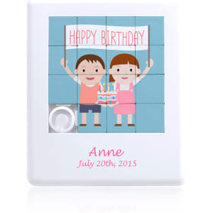 A white mini puzzle featuring two cartoon children holding a cake with candles, celebrating a birthday.