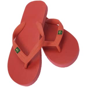A pair of red flip flops with a logo feature. The footwear has thong straps and a textured sole.