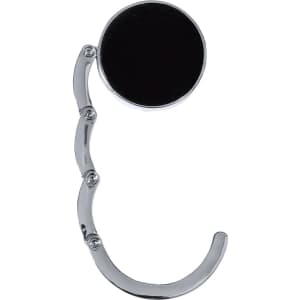A chrome-finished foldable bag hanger with a circular black base, featuring a curved handle design.