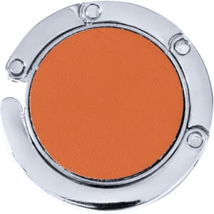 A round, foldable bag hanger in orange with a chrome finish, featuring a logo on the surface.