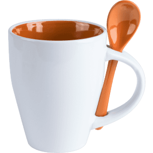 A white coffee mug with an orange interior, featuring an orange spoon attached to the handle.