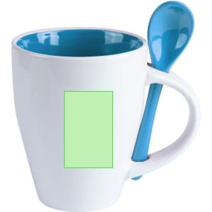 A coffee mug with a white exterior, turquoise interior, and a matching spoon attached to the handle.