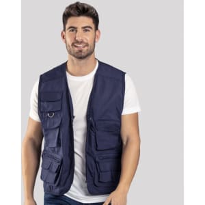 A navy blue vest featuring multiple pockets, worn by a smiling model. The vest has a logo on it.