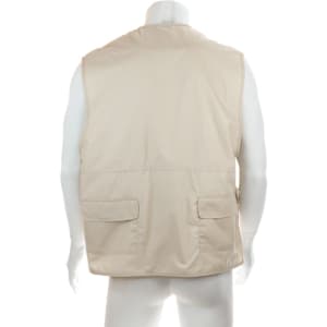 A beige vest displayed on a mannequin, featuring two front pockets and a simple design. It has a logo on the label.