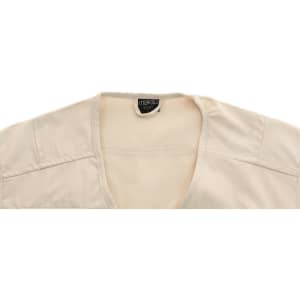A cream-coloured vest with a V-neck design and mesh detailing at the neckline. It features a logo inside.