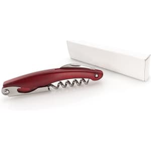 A red corkscrew with a stainless steel spiral, placed next to a plain white box.