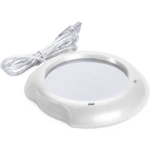 A mug warmer in white with a USB cable, designed to keep drinks warm. Features a smooth surface and rounded edges.