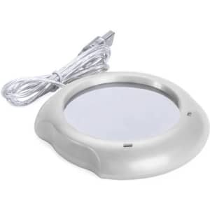 A mug cup warmer in white, featuring a round heating surface and a USB connection for power.