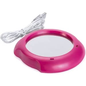 A pink mug cup warmer with a silver heating surface and a USB power cord.